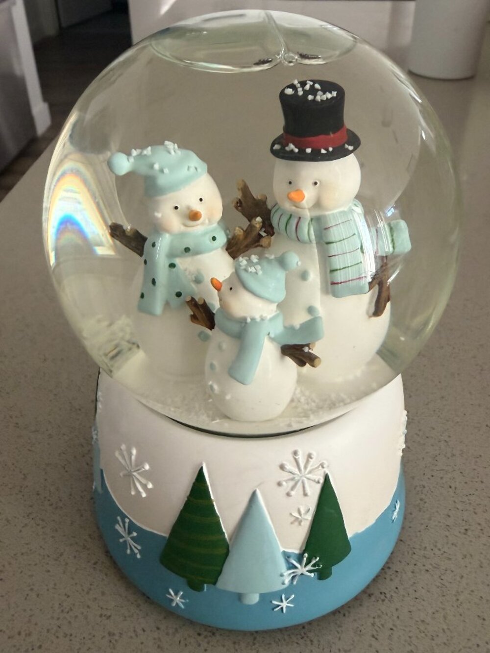 Musical Christmas Snow Globe Featuring a Snowman family
